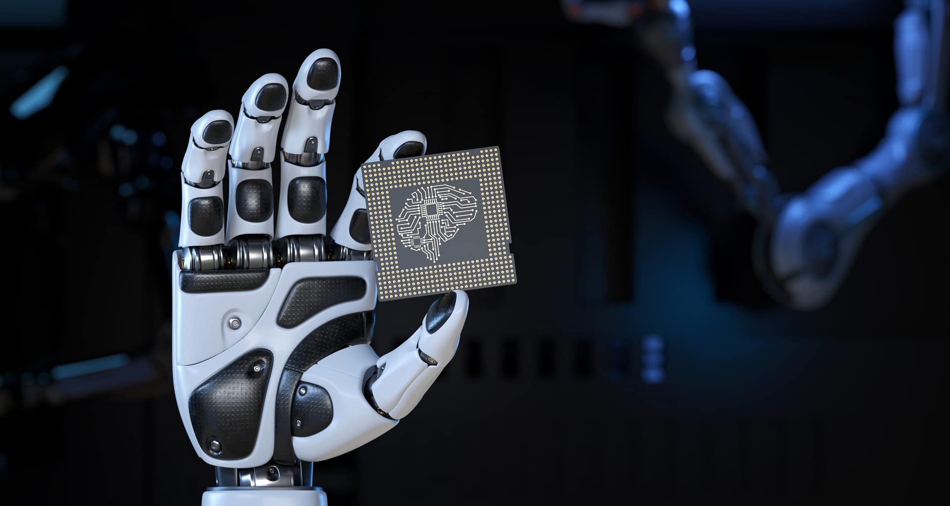 TCS-Jennifer-6 Robot hand holding a microchip against dark background