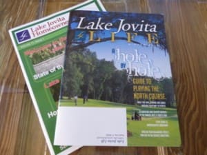 TCS-Jennifer-6 Lake Jovita community newsletters on wooden table.